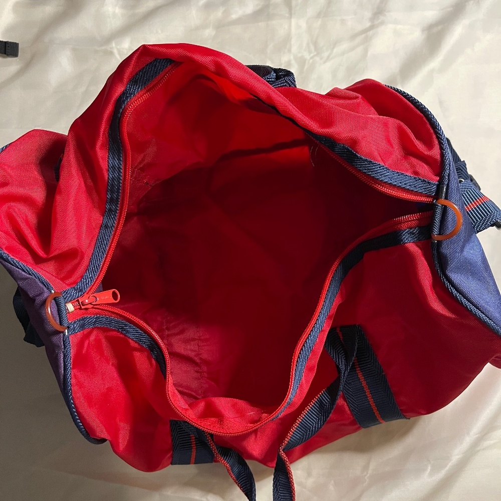 Small red duffel bag